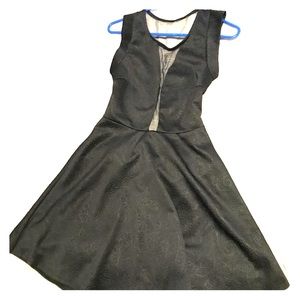 Tiny black dress (with transparent areas)